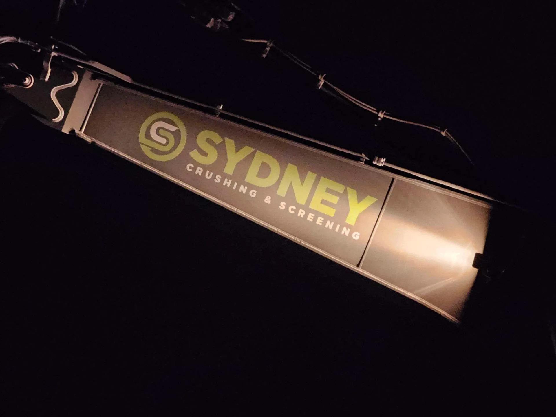 Sydney Crushing & Screening branding on a conveyor