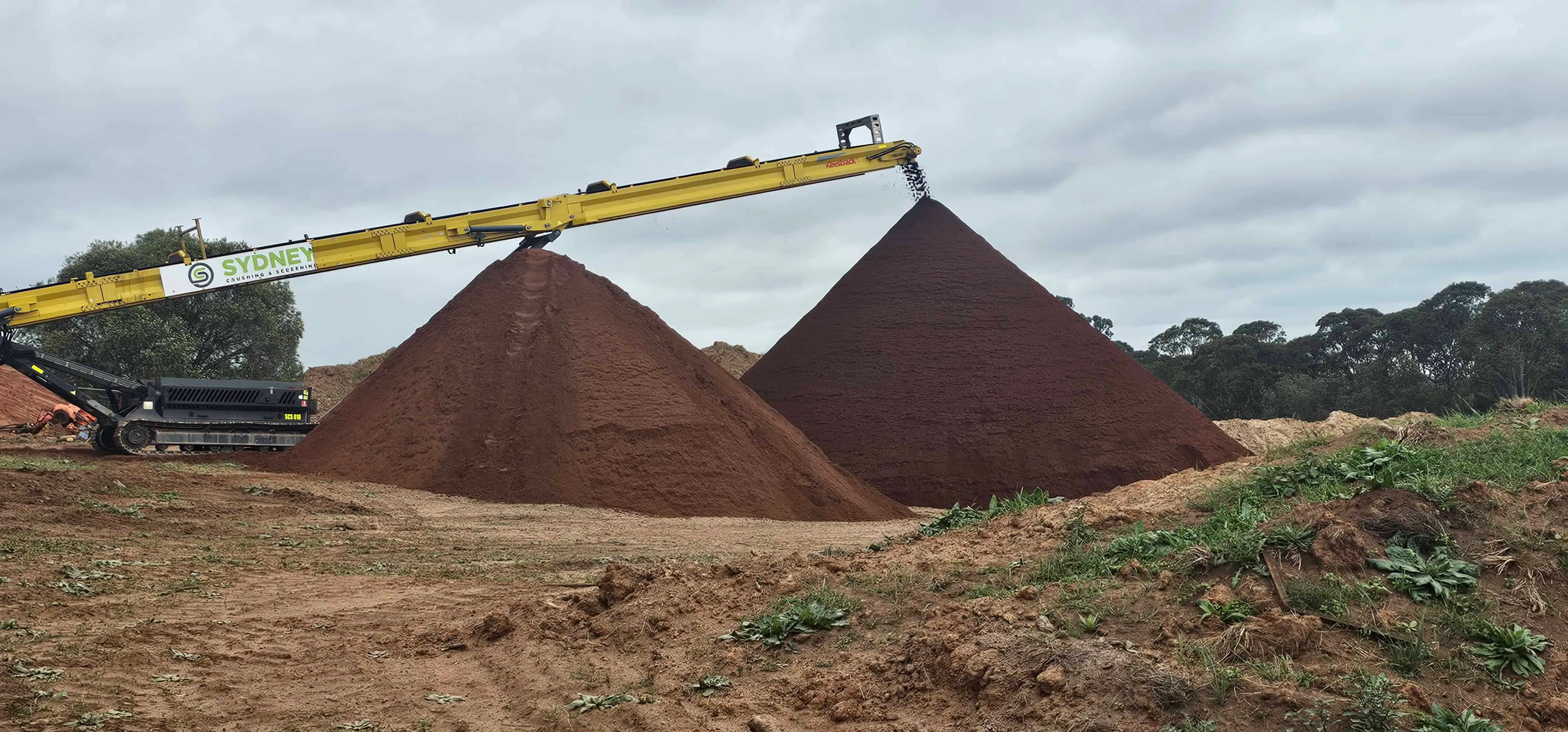 Screened material sorted into separate stockpiles