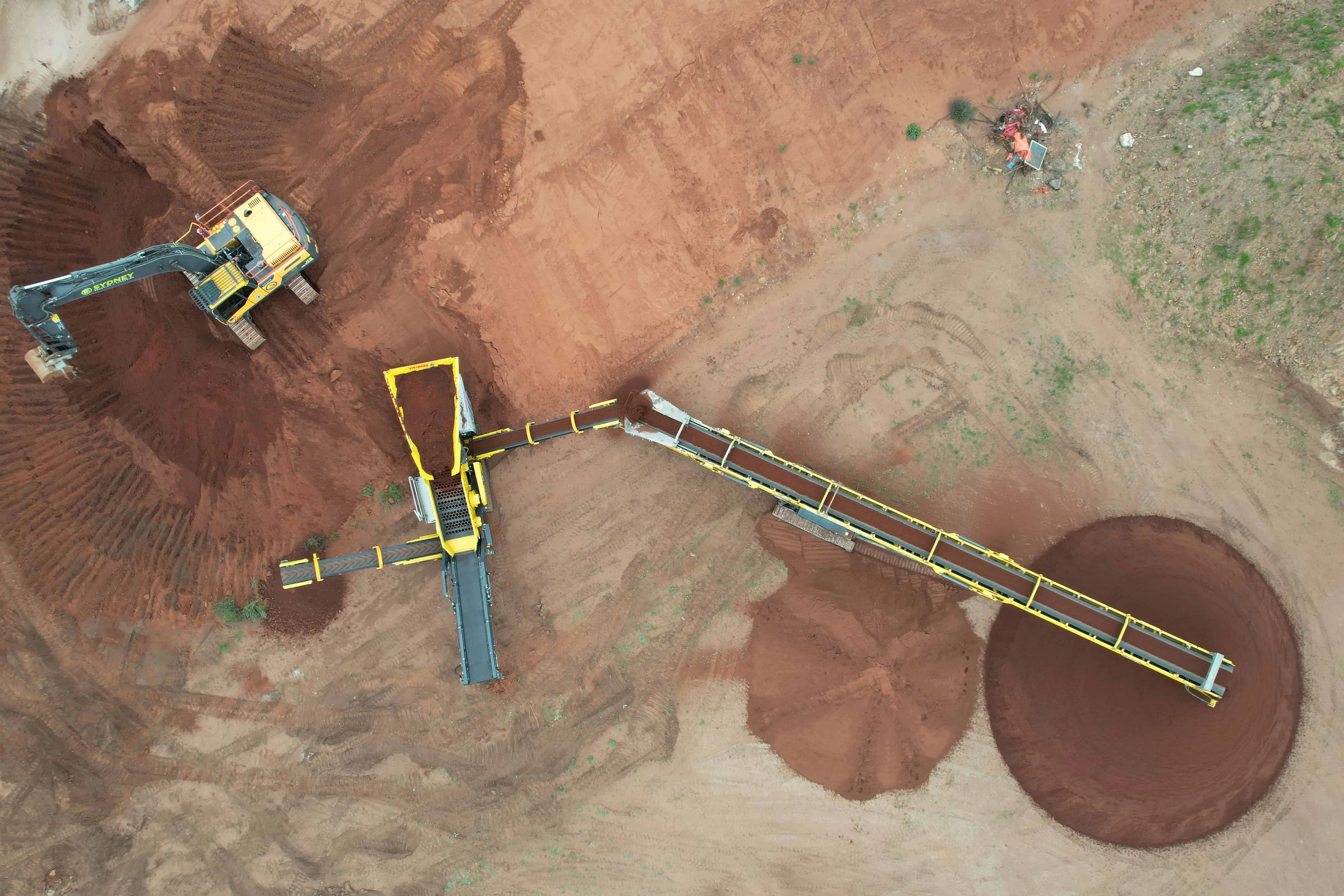 Aerial view of graded stockpiles beside the screen