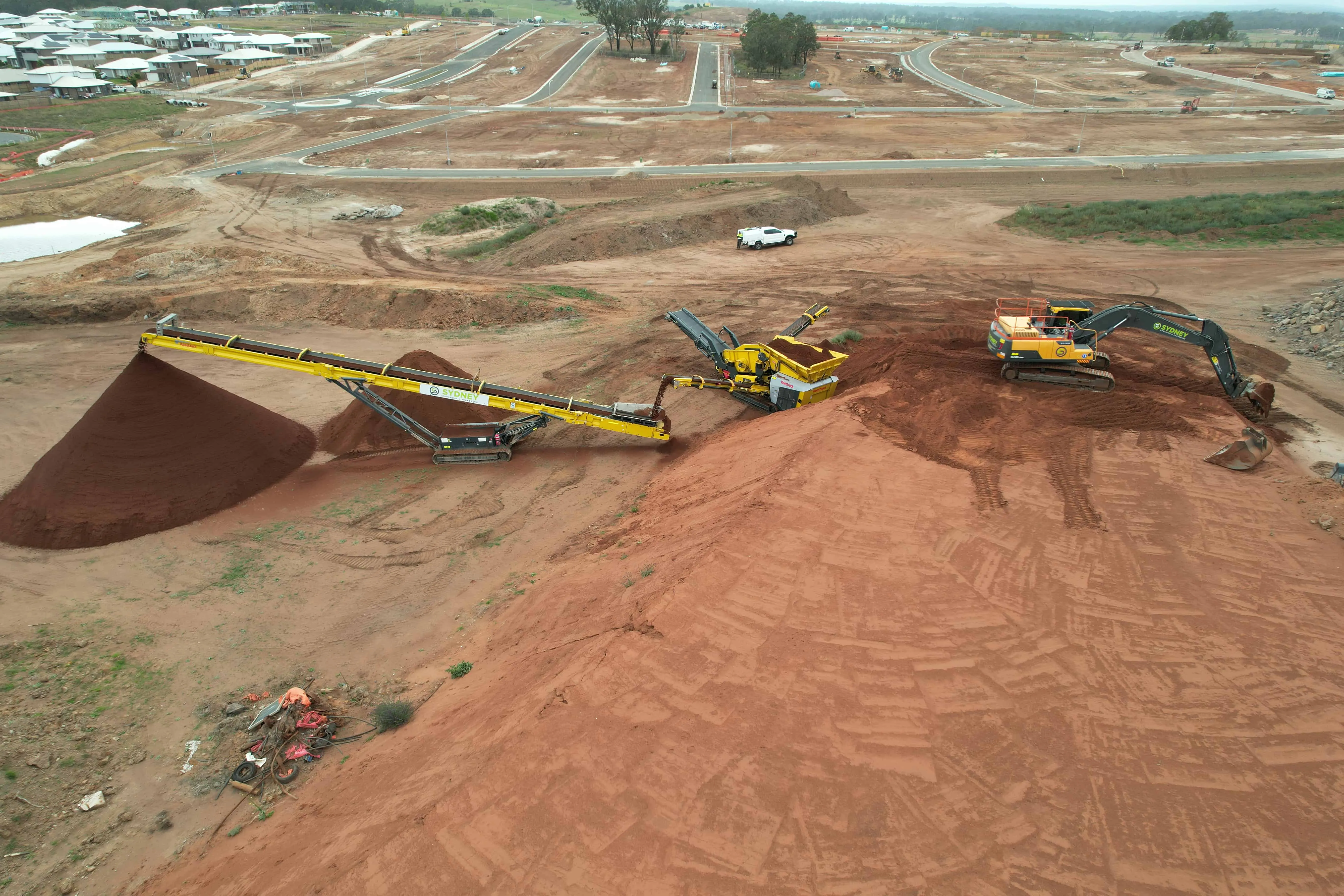 Aerial view of graded stockpiles beside the screen