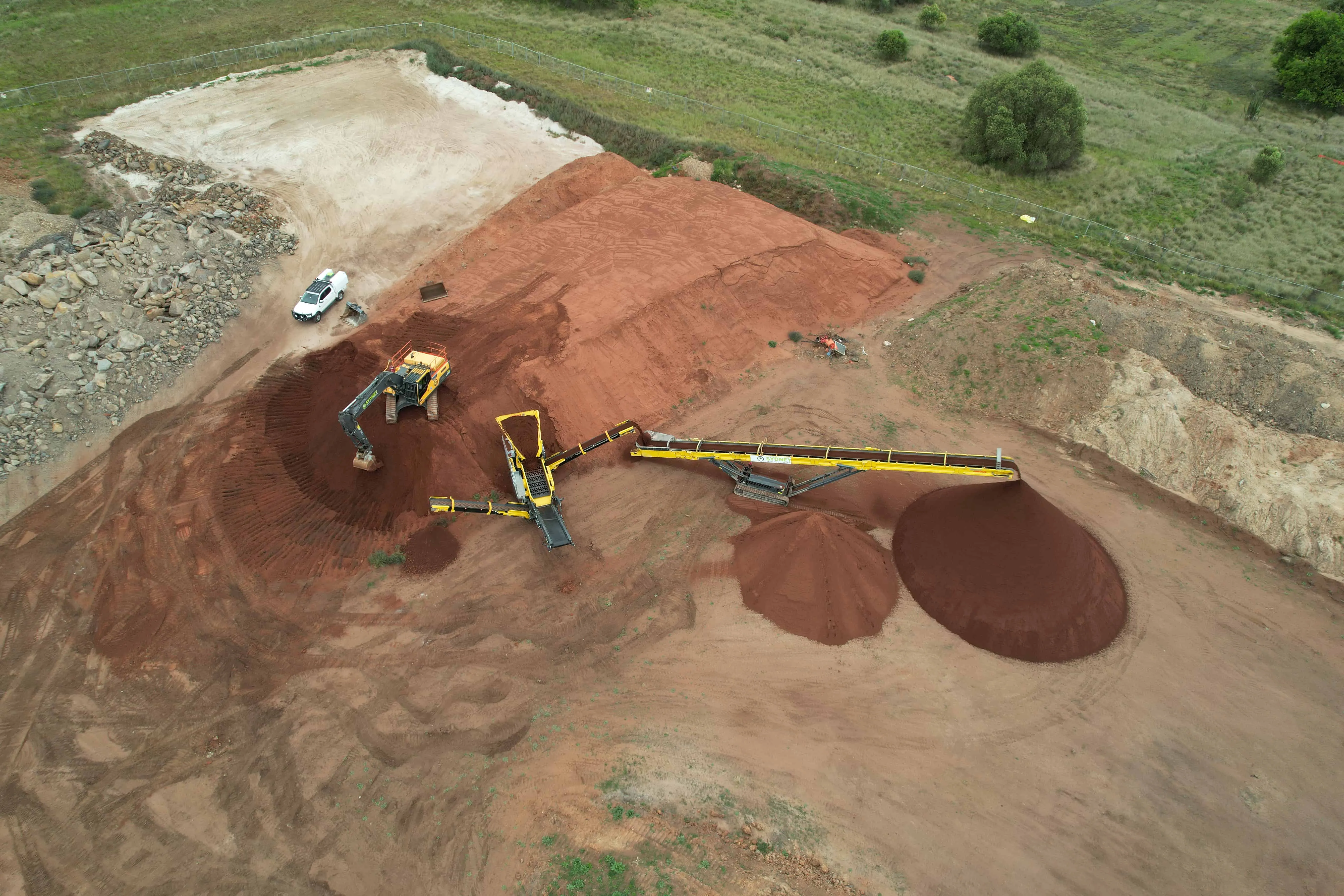 Aerial view of screened soil stockpiles on a Sydney site