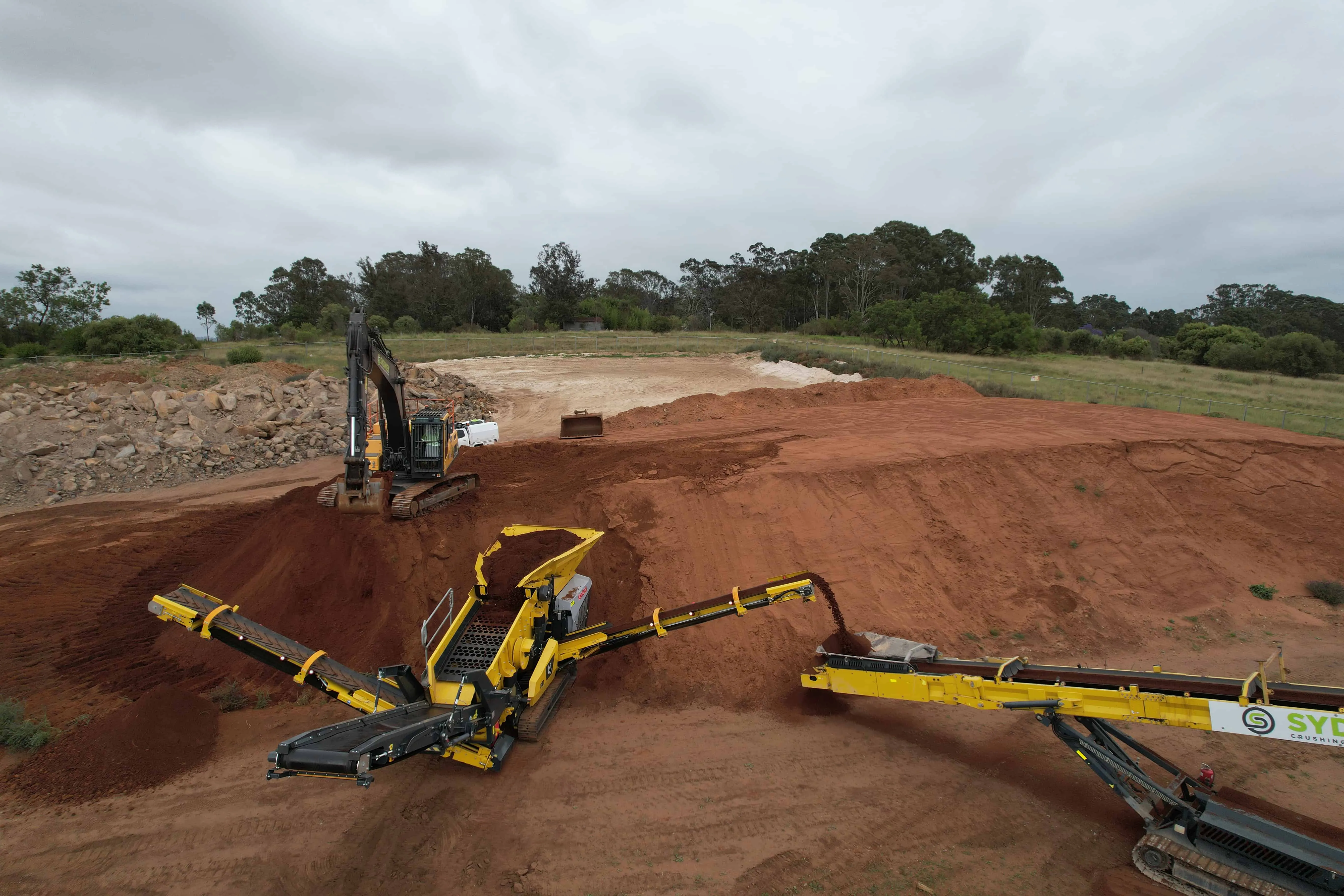Aerial view of a scalper screen separating material on site